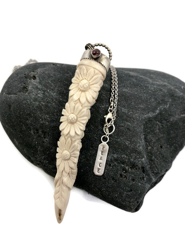 Chamomile

The chamomile pendant and the original painting, Chamomile by Cathy Nichols are sold as a set.

Release any disquieting thoughts. Take some time to be still and cultivate harmony in all your relationships. 

A naturally shed deer antler with carved chamomile flowers. The carving is topped with fine and sterling silver cap set with a pink tourmaline cabochon. Stamped tag at clasp reads PEACE and features a hand fabricated peace sign.

Original Chamomile Painting
"Each painted